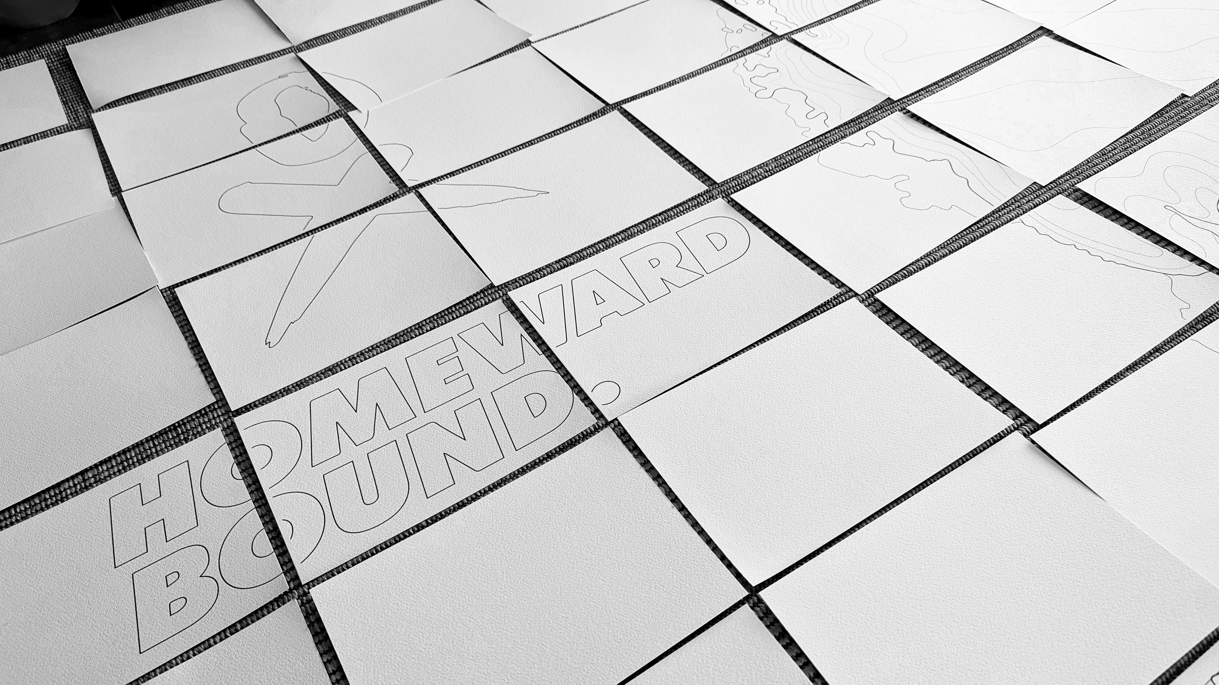 Postcards laid out before the voyage — blank canvases awaiting their makers' voices